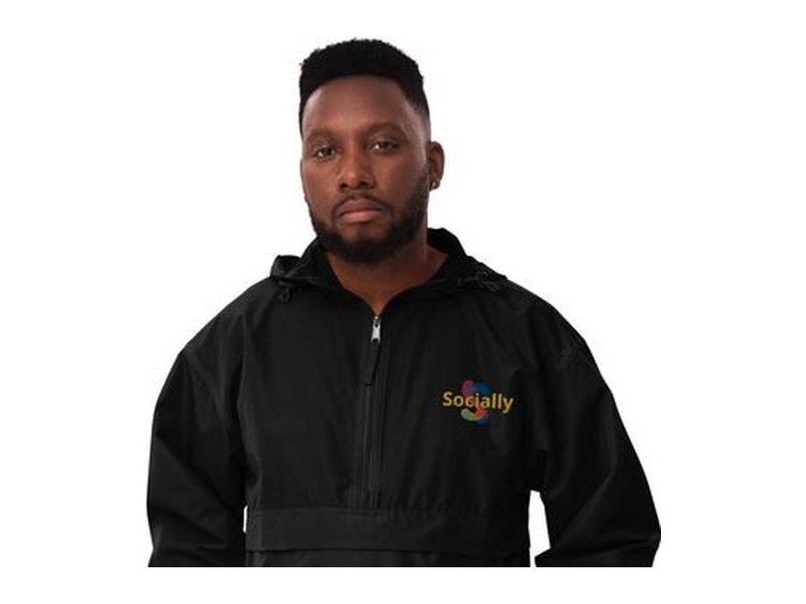 Black Champion packable jacket with the Socially logo embroidered on the chest